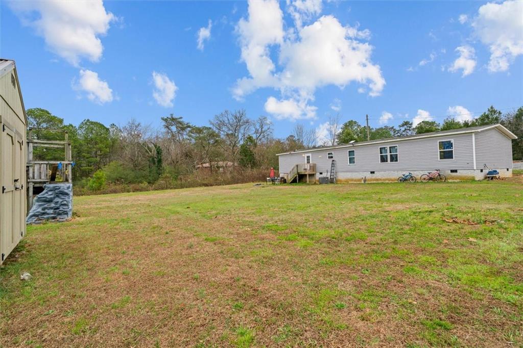 1185 Shirley Road Southeast Fairmount, GA 30139 - Photo 38 of 50 a view of a house with a big yard