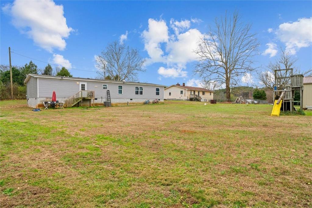 1185 Shirley Road Southeast Fairmount, GA 30139 - Photo 39 of 50 a view of a yard with swimming pool and brick wall