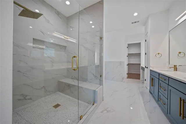 a bathroom with a shower and a sink
