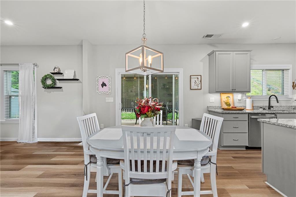 230 Augusta Walk Canton, GA 30114 - Photo 21 of 56 a view of a dining room with furniture window and wooden floor