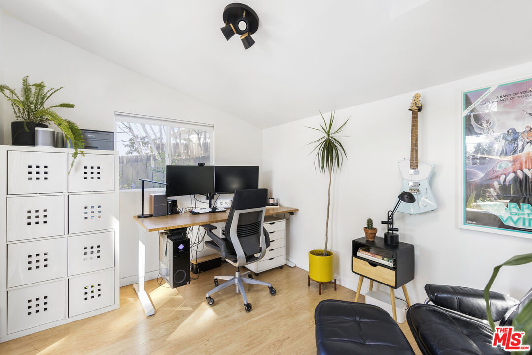 7543 Kyle Street Tujunga, CA 91042 - Photo 17 of 21 a view of a workspace with furniture and a potted plant