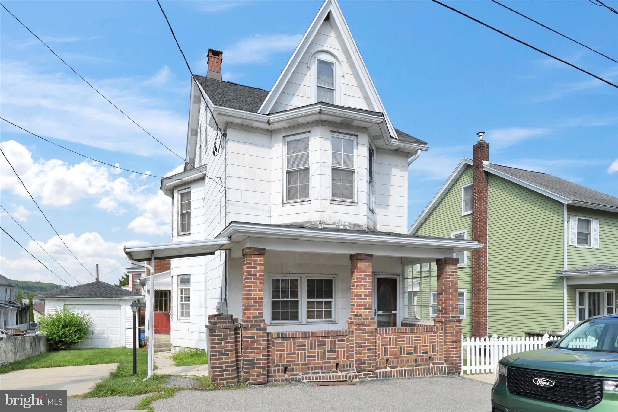 a view of a white building among the street