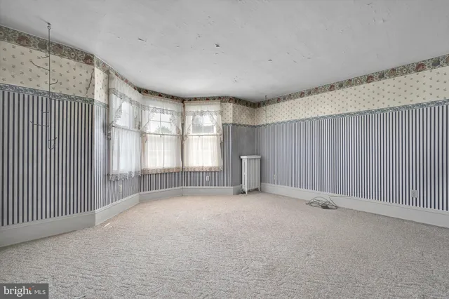 a view of a room with windows