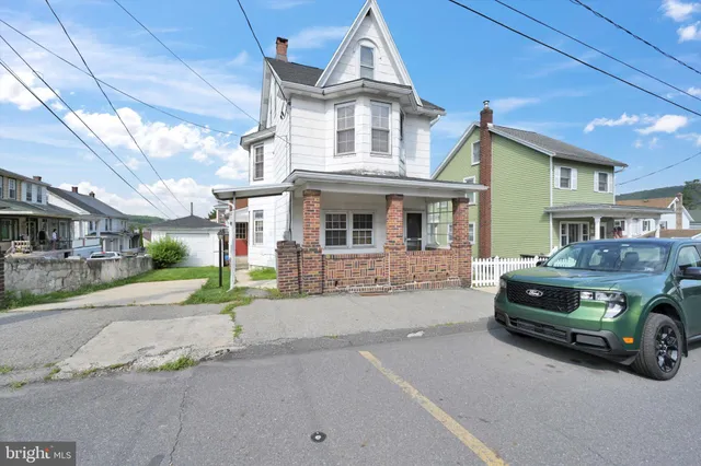 a car parked in front of a house