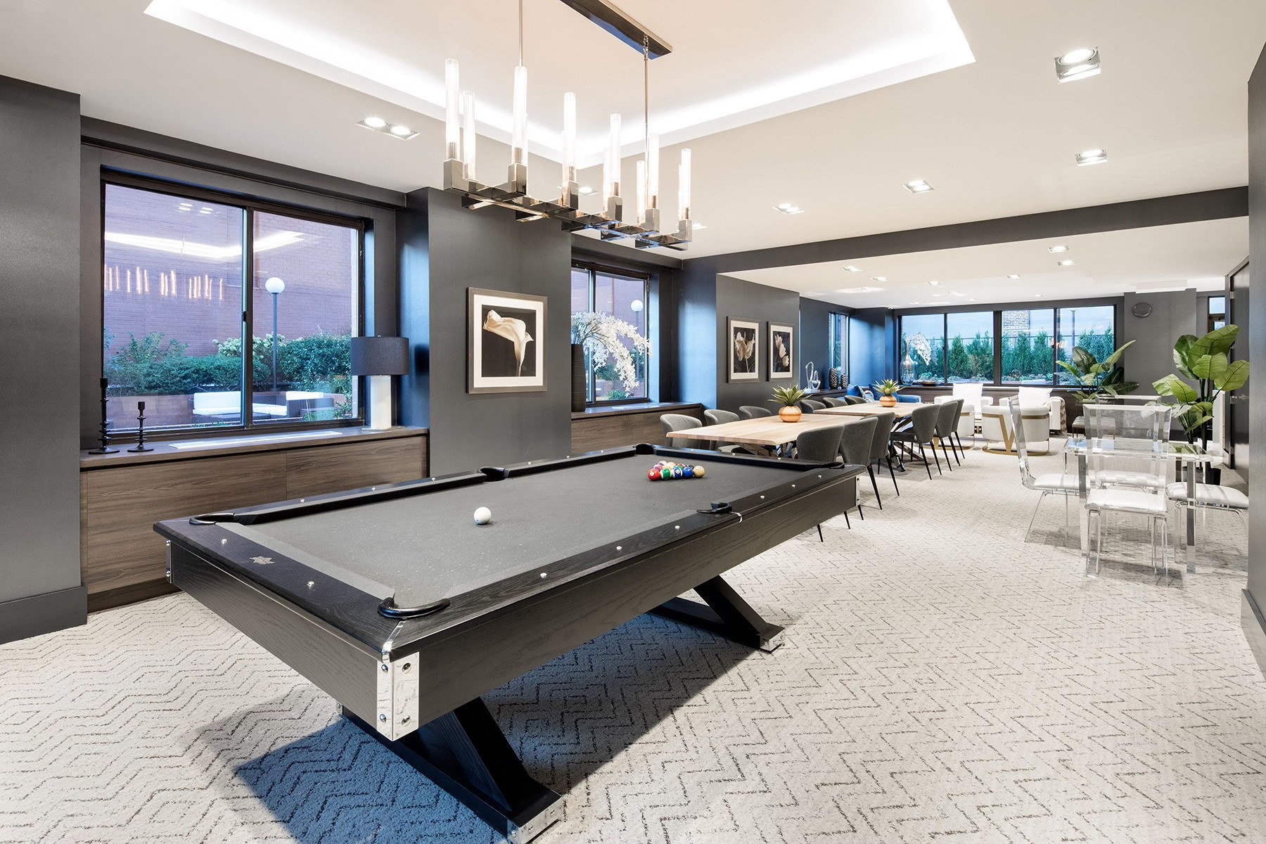 1735 York Avenue, Unit 12H Manhattan, NY 10128 - Photo 14 of 23 a room with lots of tables a large window and chairs