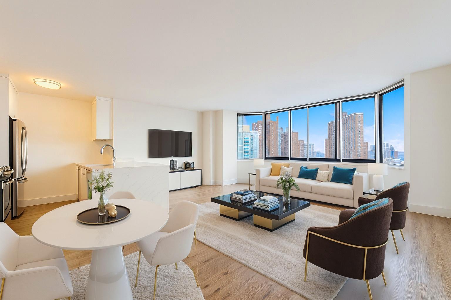 1735 York Avenue, Unit 12H Manhattan, NY 10128 - Photo 4 of 23 a living room with furniture and a flat screen tv