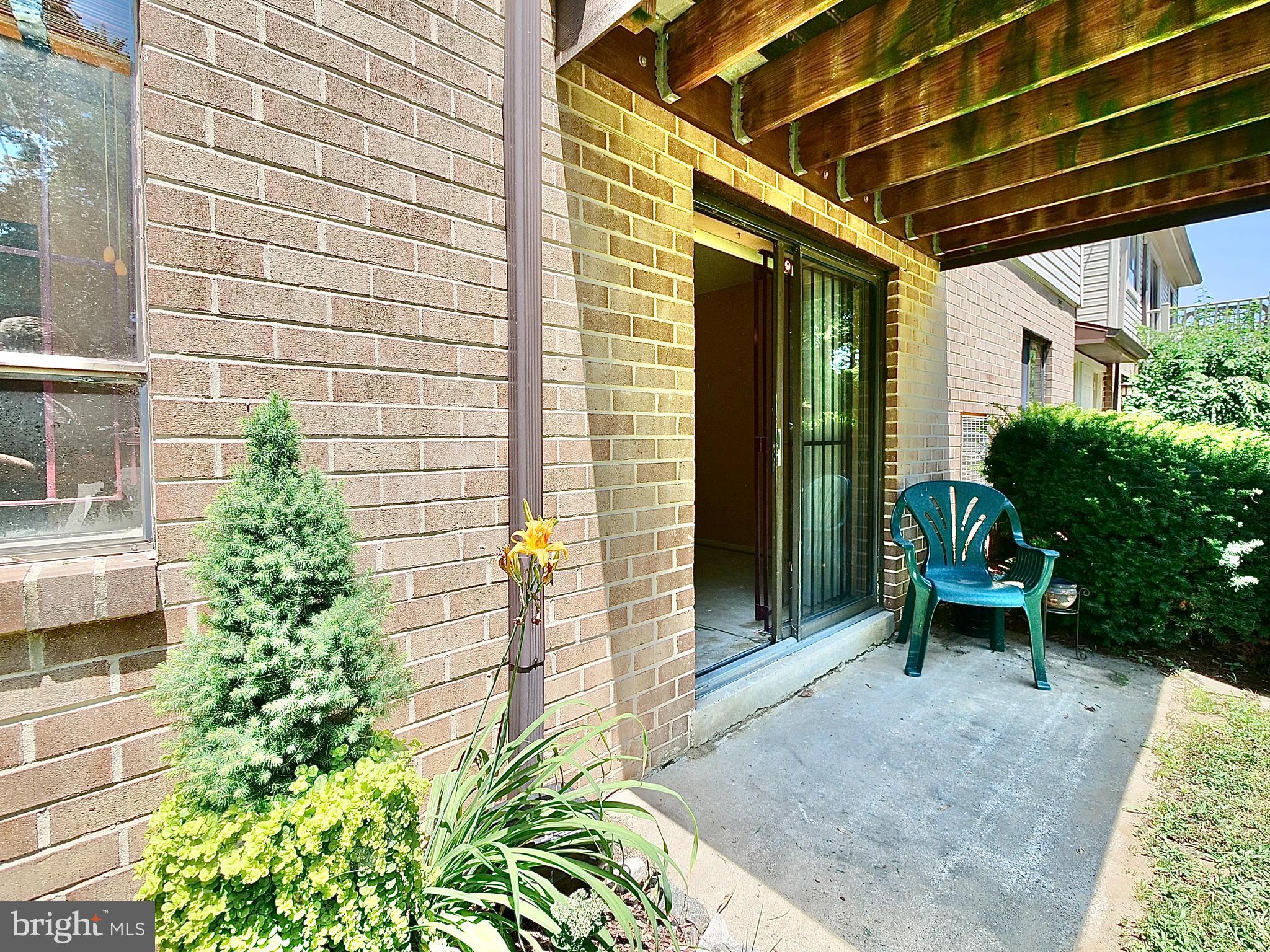 280 Bridgewater Road, Unit E8 Brookhaven, PA 19015 - Photo 26 of 33 Covered Patio and garden