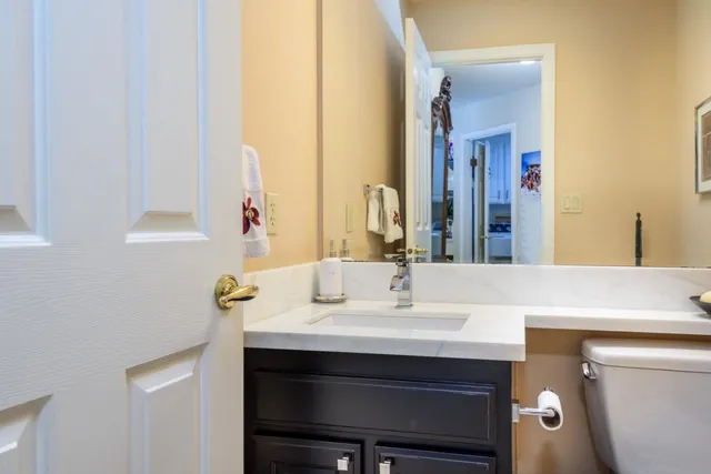 a bedroom with furniture and a large window