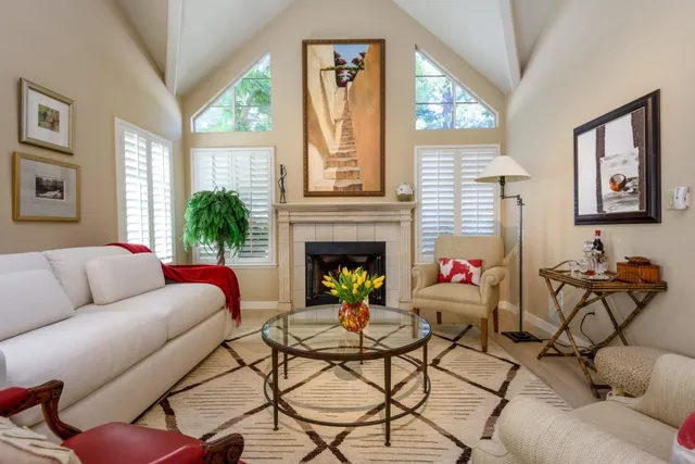 a living room with furniture and a fireplace