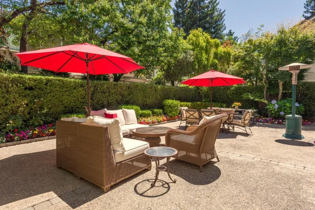 an outdoor space with furniture and umbrella