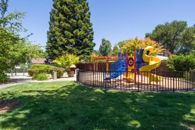 a view of a patio with swimming pool and sitting area