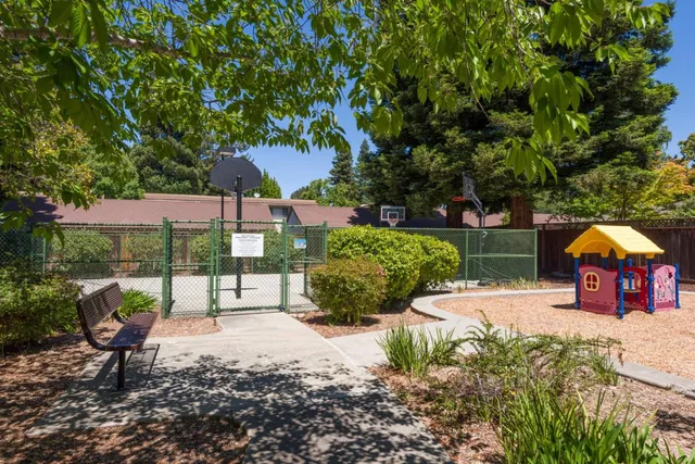 a view of a house with backyard porch and sitting area