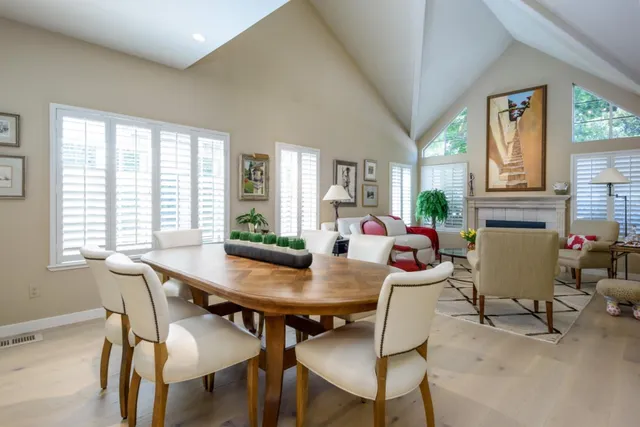 a view of a dining room with furniture and a window