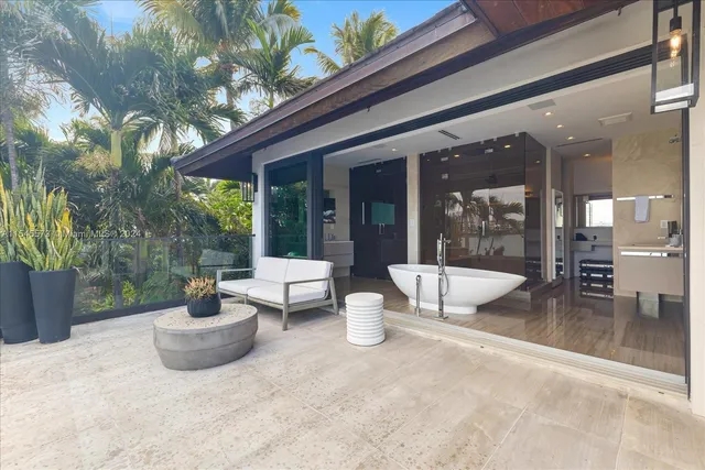 a spacious bedroom with a bed and a window