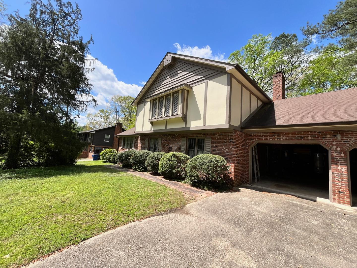 3808 Oak Park Road Raleigh, NC 27612 - Photo 12 of 19 a front view of a house with a garden and plants