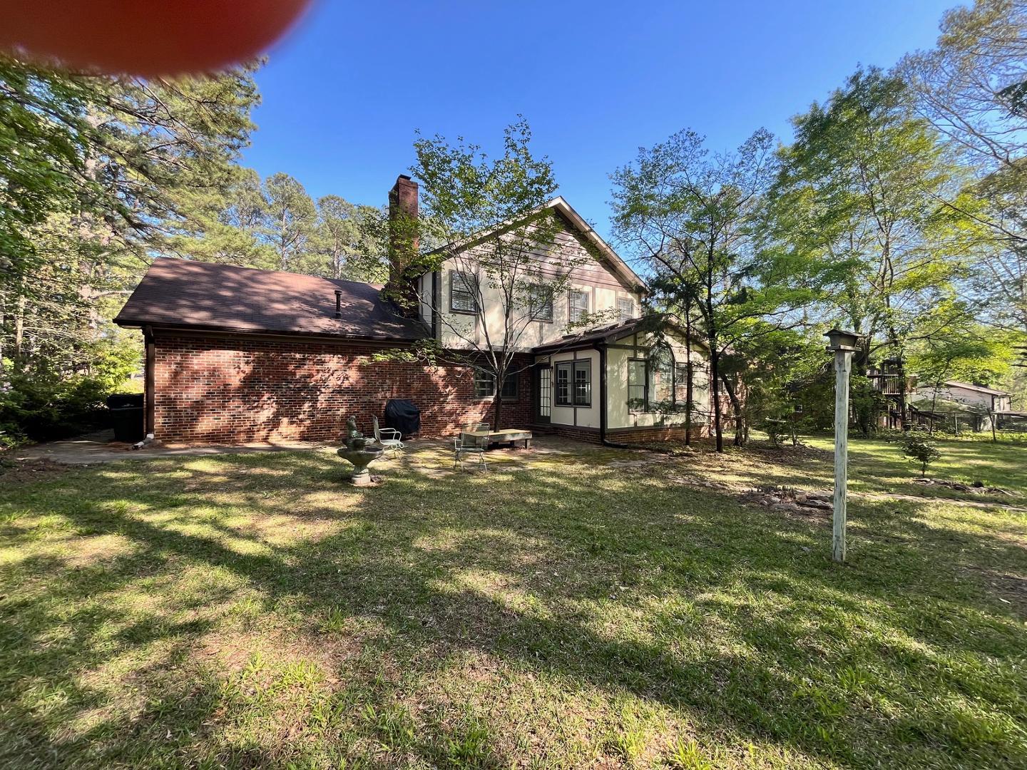 3808 Oak Park Road Raleigh, NC 27612 - Photo 14 of 19 a front view of a house with a garden