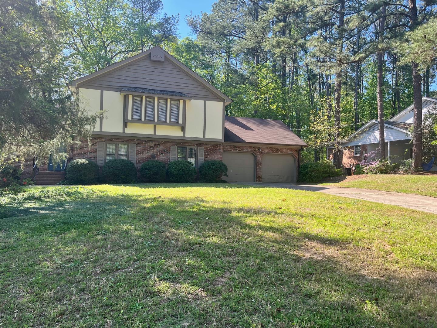 3808 Oak Park Road Raleigh, NC 27612 - Photo 15 of 19 a front view of a house with a yard