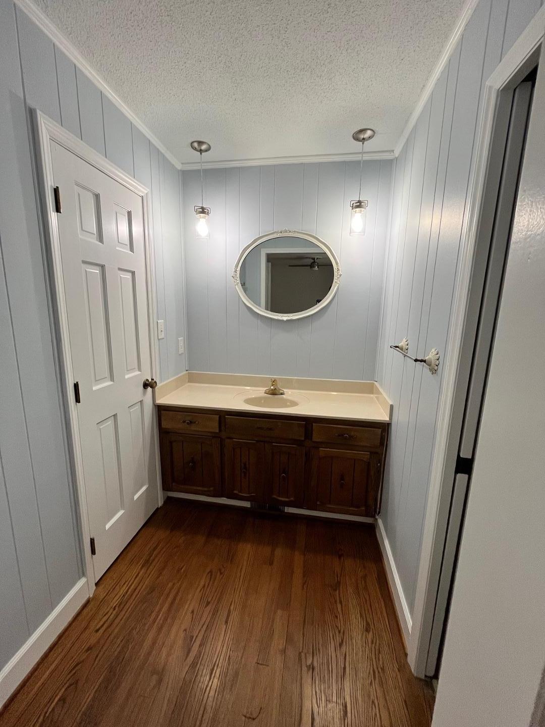 3808 Oak Park Road Raleigh, NC 27612 - Photo 18 of 19 a living room with furniture and a wooden floor