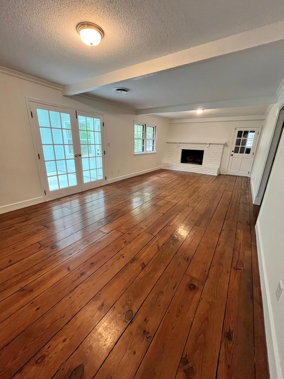 3808 Oak Park Road Raleigh, NC 27612 - Photo 7 of 19 a view of livingroom with hardwood floor and a ceiling fan
