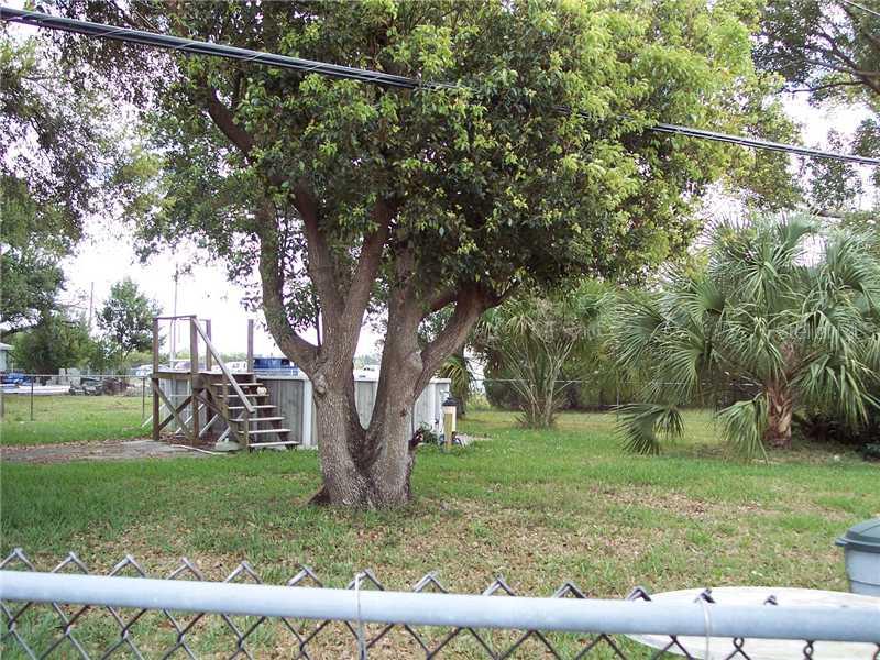 Pensdale New Port Richey, FL 34652 - Photo 1 of 1 Land/Lot - Adjacent to MLX W7528191. Fenced with a nice above ground pool in the center of the lot.