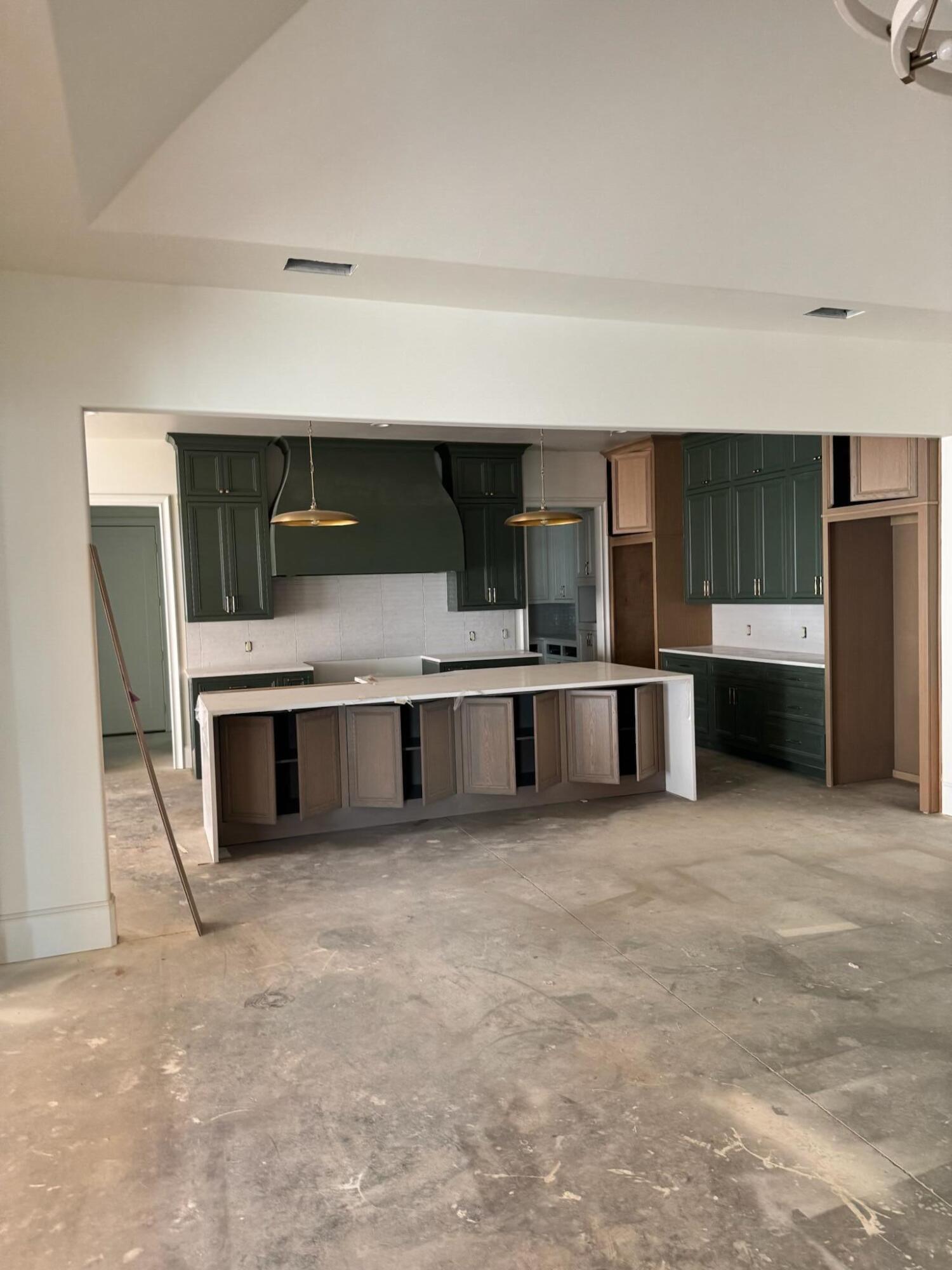 4007 150th Street Lubbock, TX 79423 - Photo 3 of 20 a large kitchen with a stove and a refrigerator