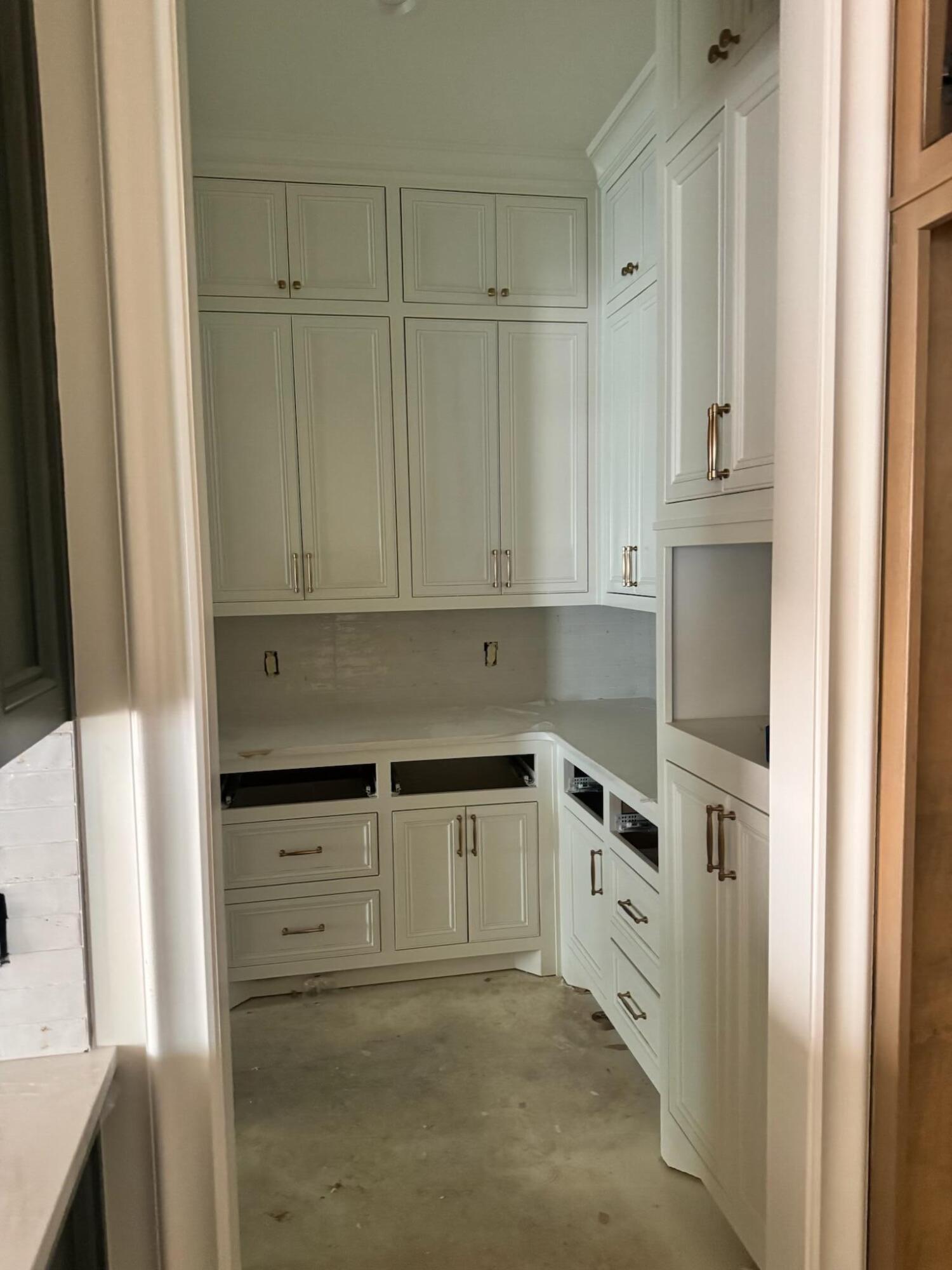 4007 150th Street Lubbock, TX 79423 - Photo 10 of 20 a kitchen with granite countertop white cabinets and refrigerator