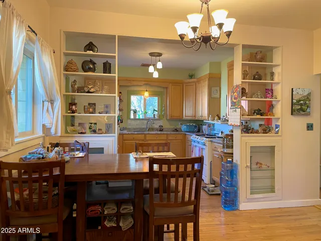 a view of a dining room with furniture and window