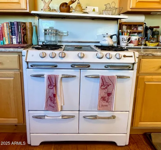 a kitchen with stainless steel appliances granite countertop a stove and a sink