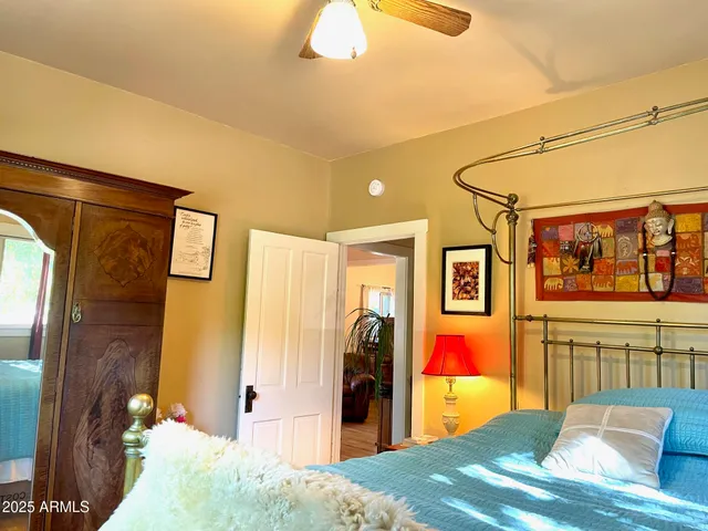 a bedroom with a bed and window