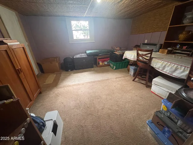 a view of a patio with table and chairs and potted plants