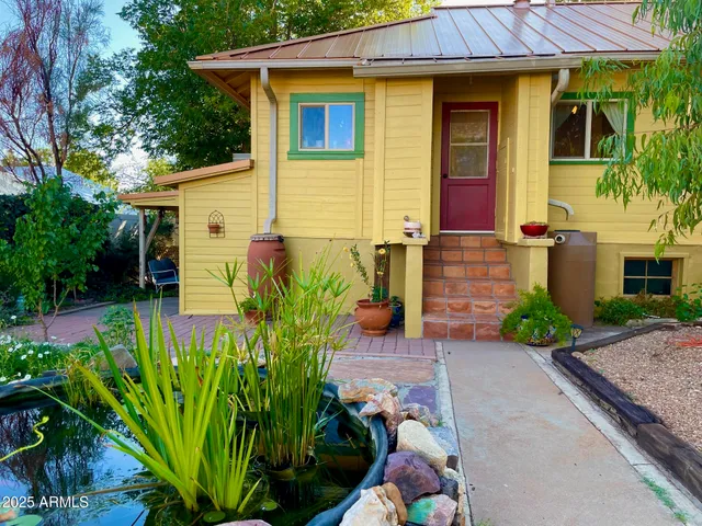 a backyard of a house with outdoor seating