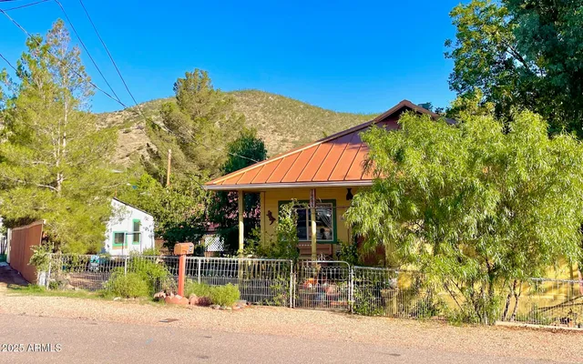a front view of a house with many windows