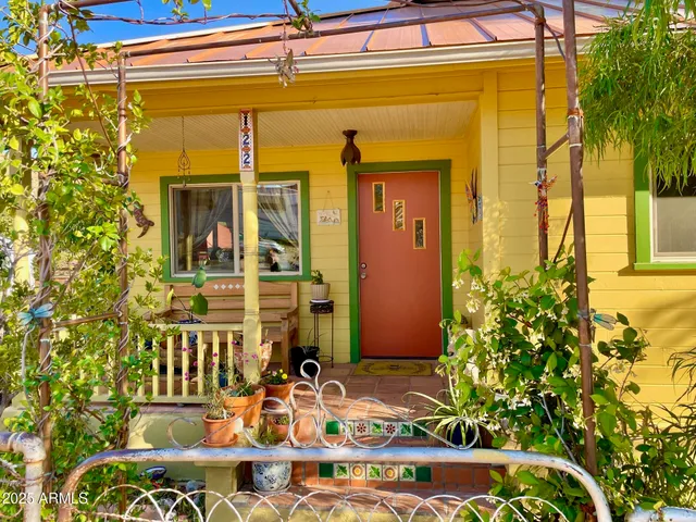 a view of a house with sitting area and garden