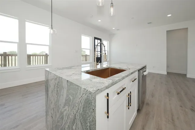a kitchen with sink and window