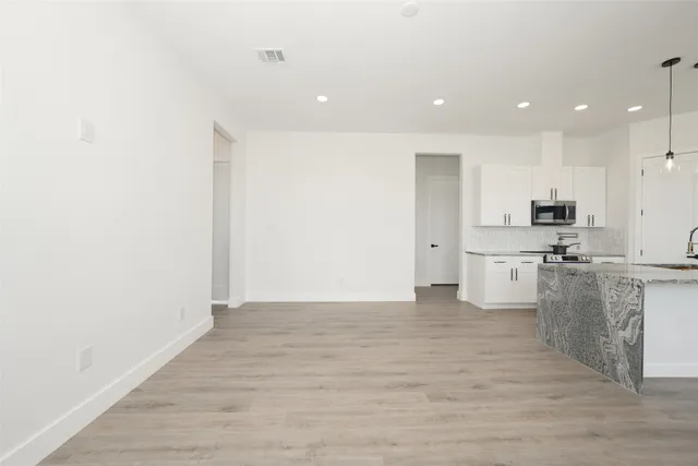 a view of kitchen with wooden floor