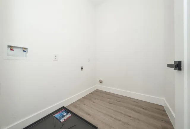 a view of a small space with wooden floor