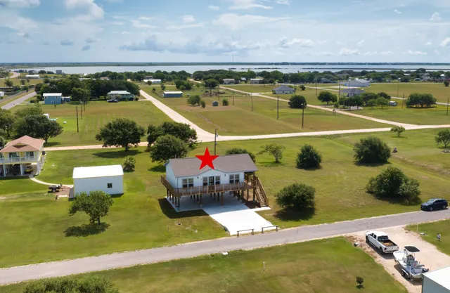 an aerial view of a house with a garden