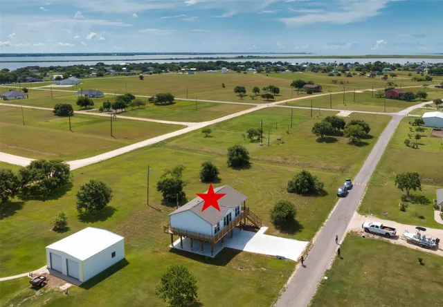 a view of a swimming pool and lounge chairs