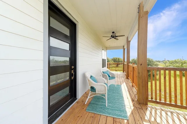 a view of a balcony with chair and table