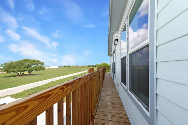 a view of balcony and yard