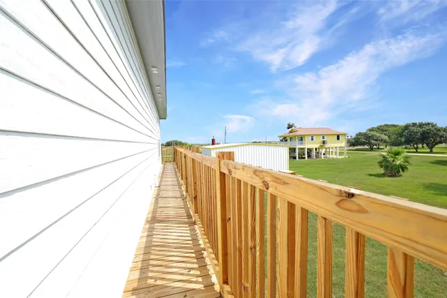 a view of a pathway of a building from a balcony