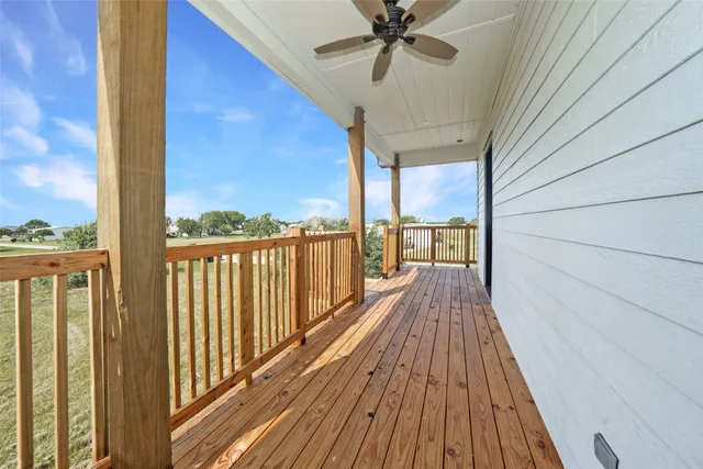 a view of a balcony with wooden floor