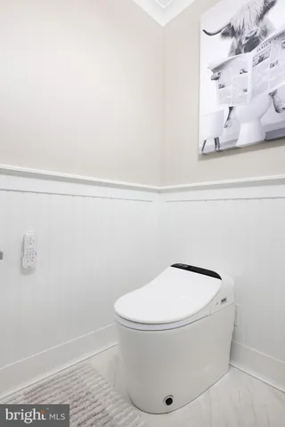 a bathroom with a shower and a glass door