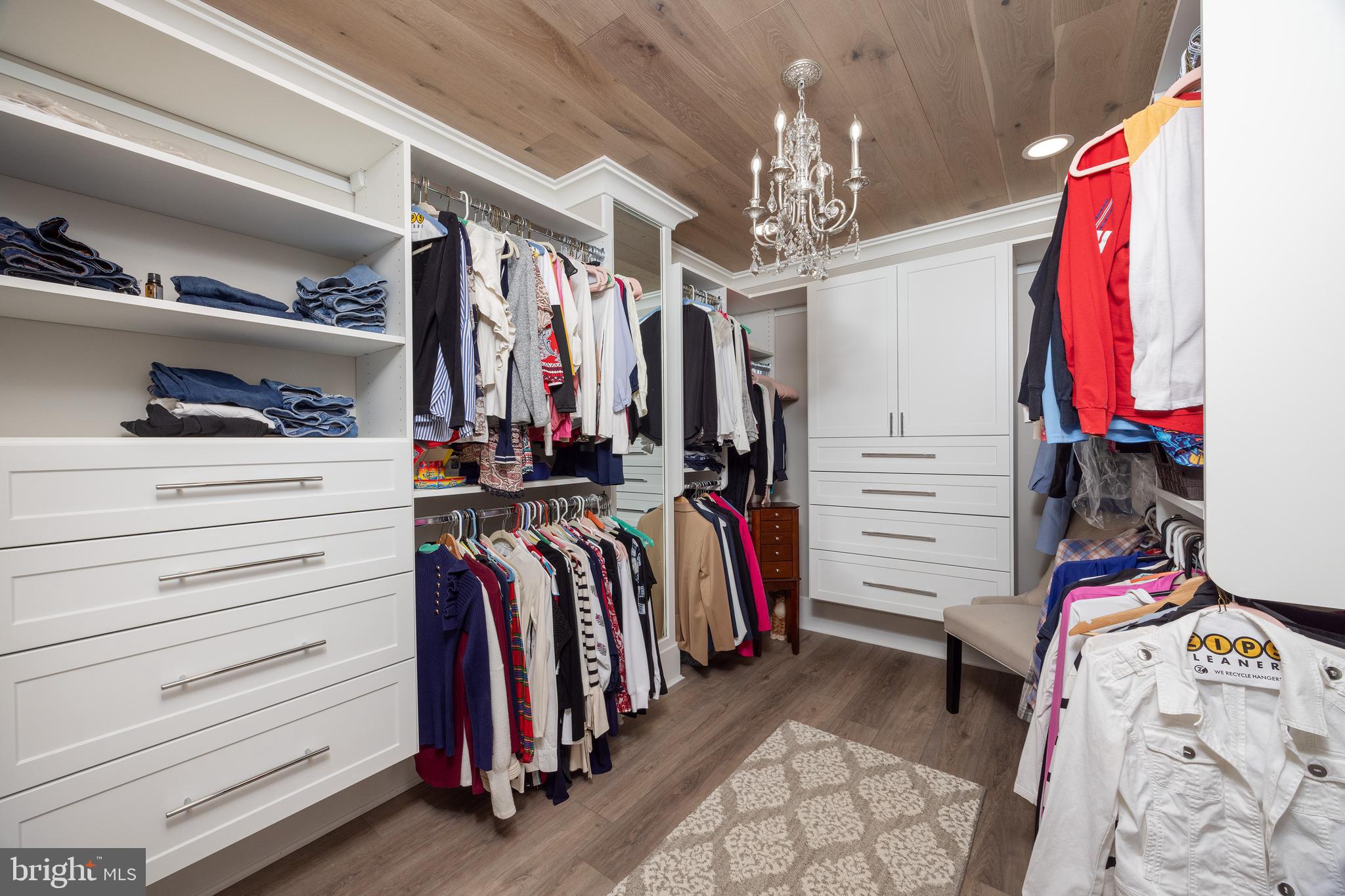 6469 Groveland Road Pipersville, PA 18947 - Photo 26 of 53 a view of walk in closet with clothes and shoes