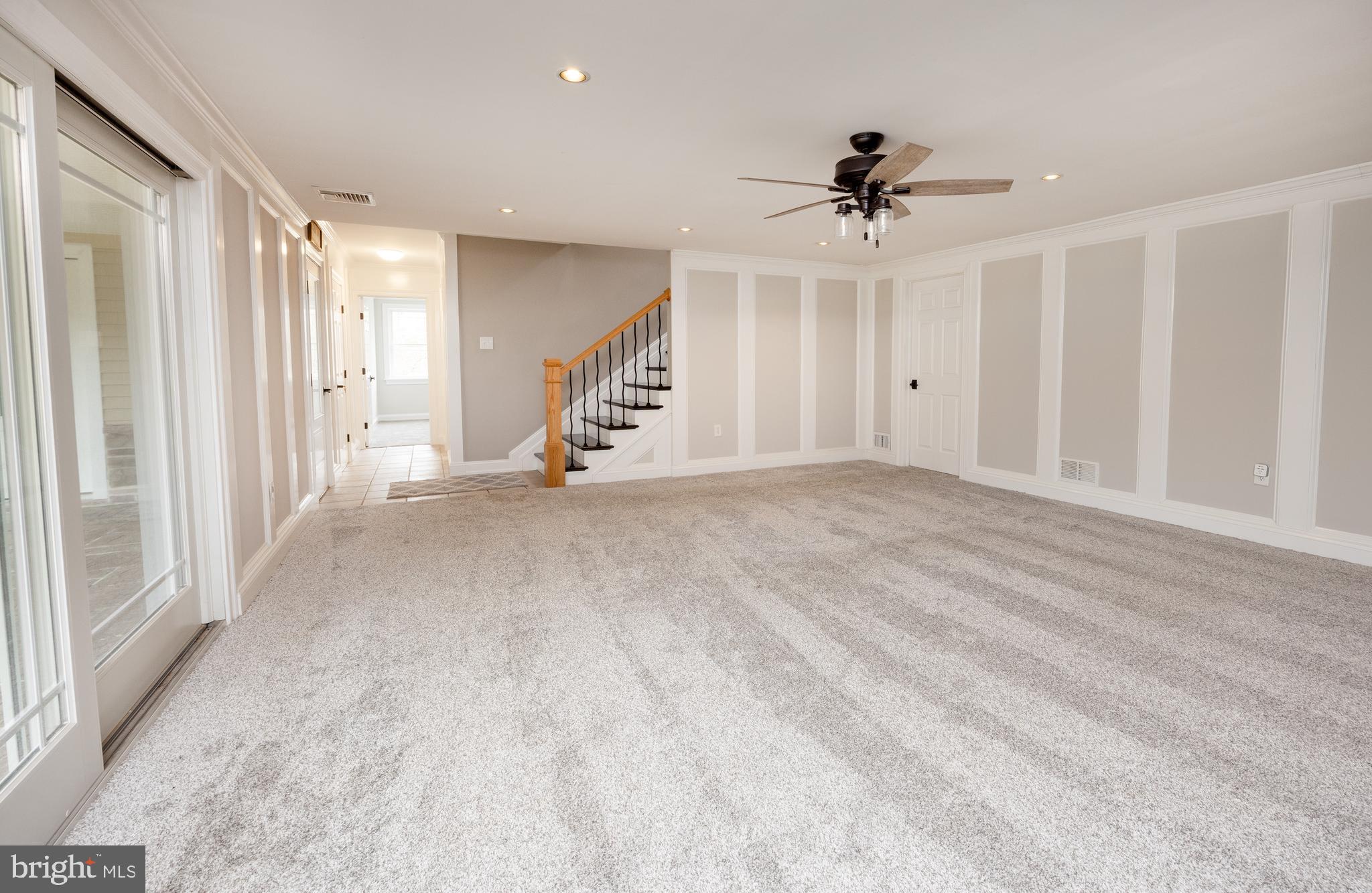 6469 Groveland Road Pipersville, PA 18947 - Photo 32 of 53 an empty room with windows and ceiling fan
