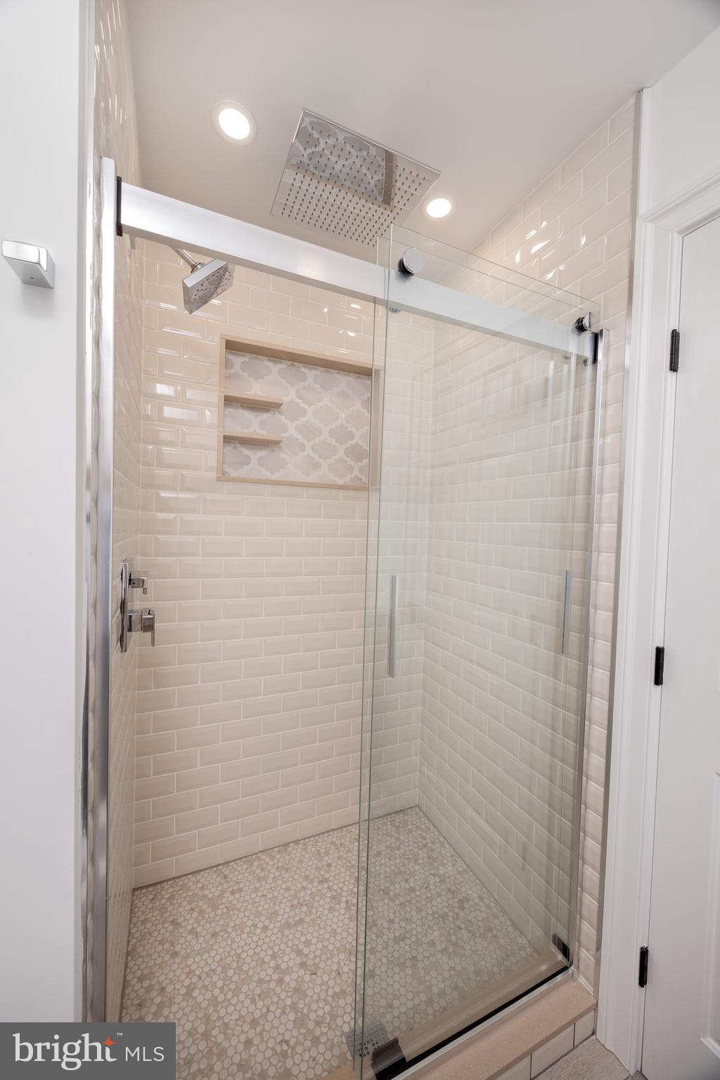 6469 Groveland Road Pipersville, PA 18947 - Photo 37 of 53 a bathroom with a shower and a glass door