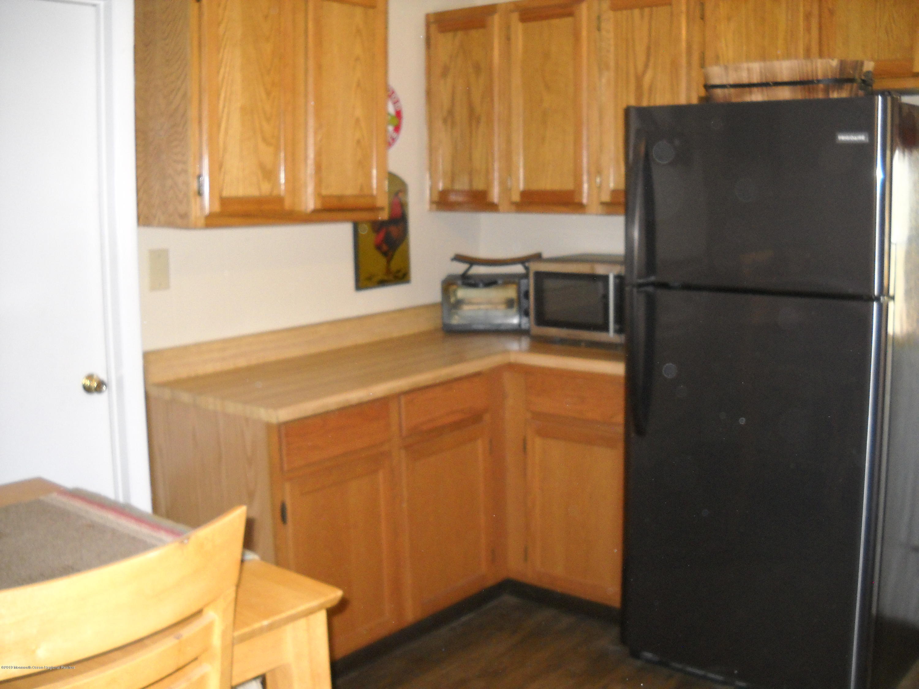 32 Hornerstown Road Cream Ridge, NJ 08514 - Photo 13 of 19 a kitchen with a refrigerator and a sink