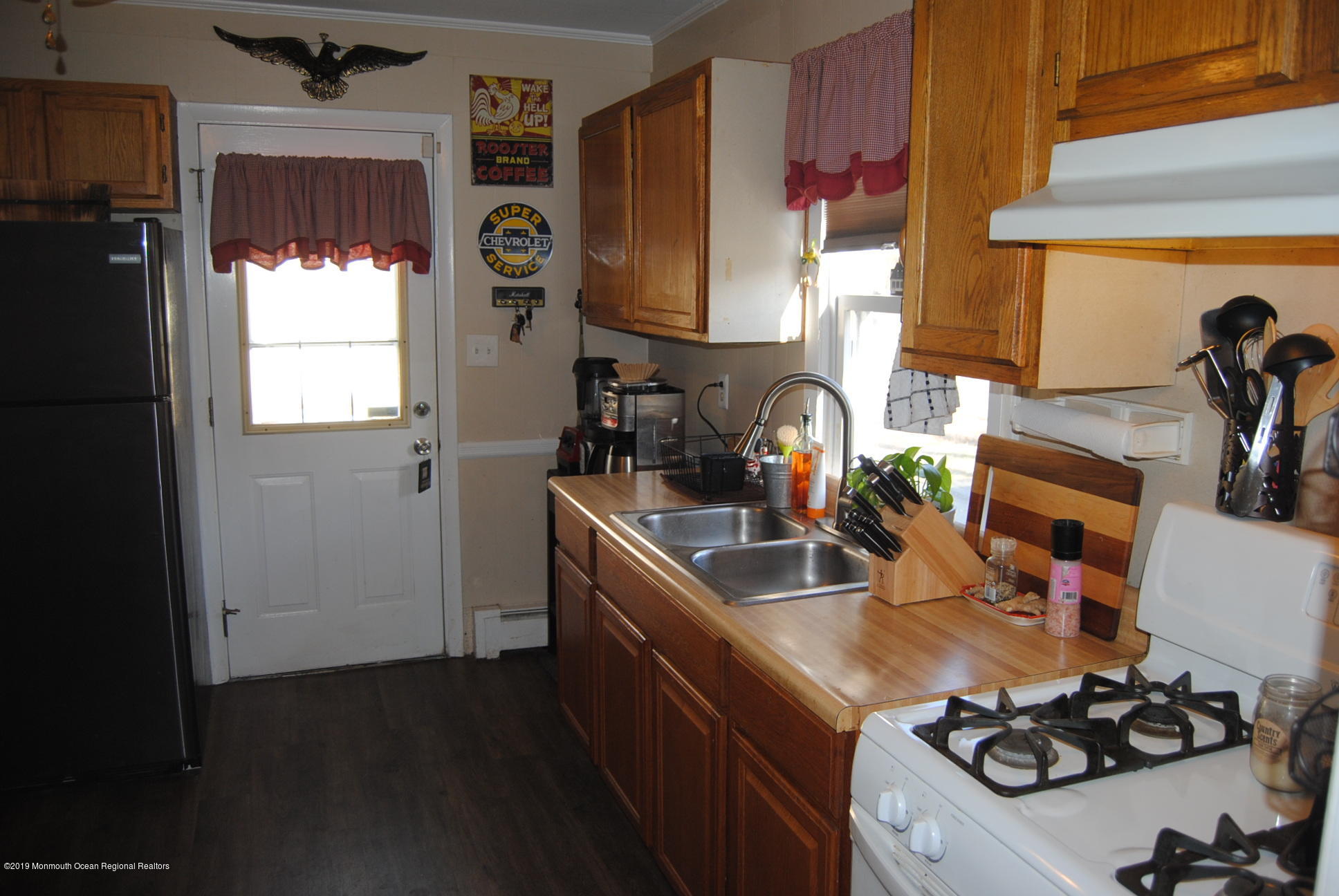 32 Hornerstown Road Cream Ridge, NJ 08514 - Photo 15 of 19 a kitchen with sink a stove and a refrigerator