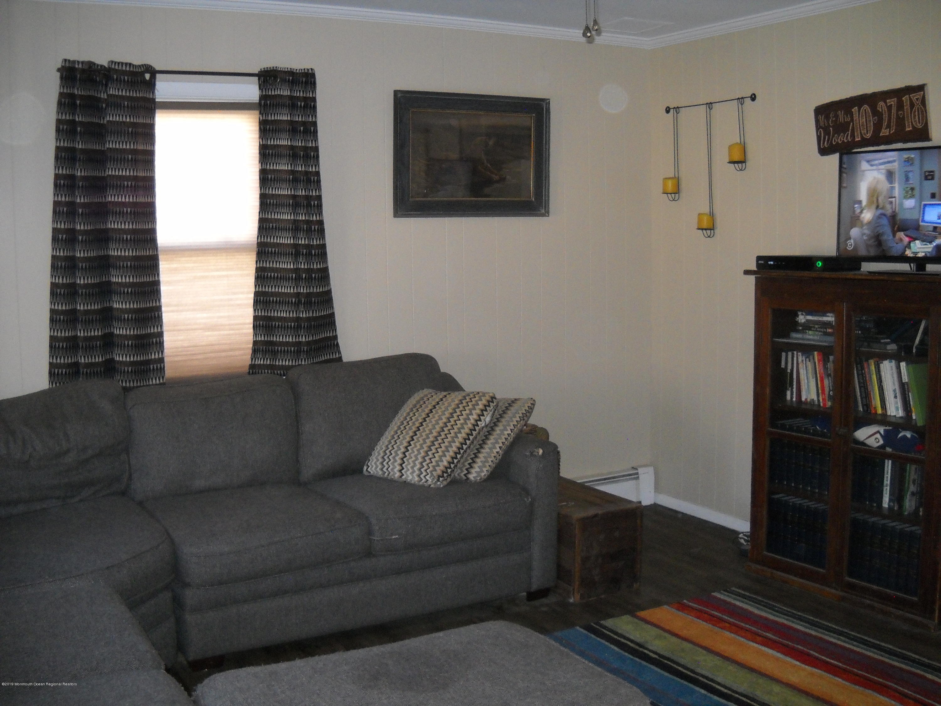 32 Hornerstown Road Cream Ridge, NJ 08514 - Photo 10 of 19 a living room with furniture and a flat screen tv