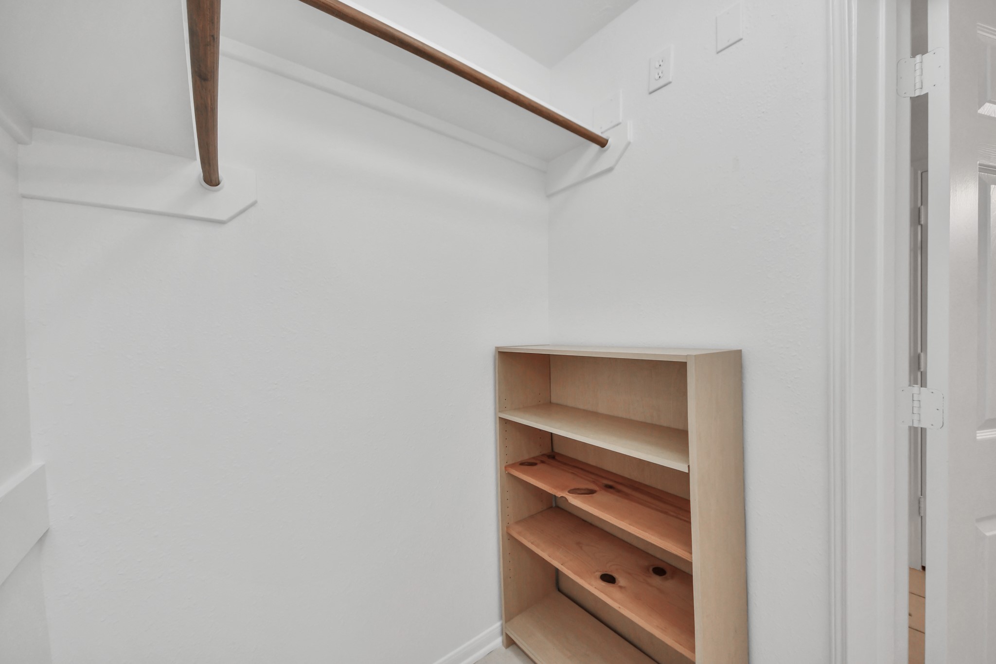 5622 Pineaster Pointe Lane Spring, TX 77379 - Photo 26 of 40 Walk-in closet with dual wood-finish hanging rods and a built-in shelving unit